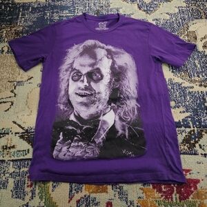 Vibrant Purple Graphic Tee with Iconic Design